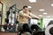 Man running rowing exercise in the gym.