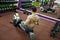 Man running rowing exercise in the gym.