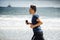 Man running on sunny beach