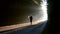 Man running at sunrise at foggy forest