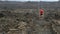 Man running - trail runner training on amazing lava waking trail on Hawaii training for marathon or triathlon ironman