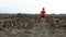 Man running - trail runner training starting running in amazing landscape