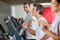 Man Running On Treadmill In Fitness Club