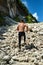 Man Running Up Rocky Hill, Exercising During Outdoor Workout. Sport