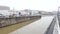 Man runs along Brussels Charleroi Canal at the cloudy day