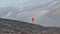 Man runs along craters on Mount Etna, Sicily, Italy