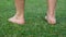 Man`s Bare Feet Take Steps On Freshly Mown Green Grass Lawn