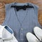 Man`s classic clothes outfit flat lay with formal shirt, vest, bowtie, shoes.