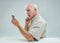 Man\'s contemplative stance over complex smartphone interaction
