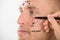 Man\'s Face With Correction Line Drawn By Person\'s Hand