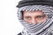 Man\'s face covered with Arab scarf