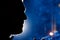 Man\'s face silhouette at night