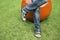 Man`s feet in black sandals on grass