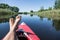 Man\'s feet over canoe.