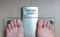 Man& x27;s feet on weight scale - Healthy weight