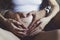 Man`s and female hands embrace a pregnant stomach
