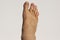 Man`s foot from top  on white background