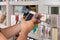 Man\'s Hand With Cellphone Scanning Product