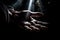 Man\\\'s hand on dark background with light beam. Close up Ai generative