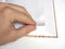 A man`s hand flips through a blank page of a book in close-up. Selective Focus