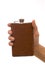 Man\'s hand holding hipflask