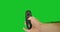 A man\'s hand holds a remote control from a smart TV and clicks on it, turns it on, off, sets the menu on the chroma