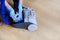 A man`s hand installing a clean empty dust bag in a vacuum cleaner.Copy space for text