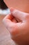 A man`s hand lies on a table in a restaurant