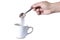 Man\'s hand pouring brown sugar in white cup