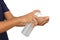 Man`s hand is pumping alcohol, a gel from a bottle, to clean his hands from the coronavirus on white background