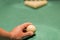 A man\'s hand puting a billiard ball. Preparation for the decisive blow