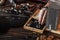 Man`s hand putting a ring in the wooden box with different accessories