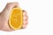 Man\'s hand squeezing Orange