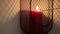 Man`s hand starts a red candle. Meditation, relaxation or romantic concept