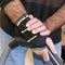 A man`s hand in strap splint wrist brace to relieve pain
