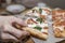 A man`s hand takes a piece of appetizing pizza in a cafe. Italian fast food. Close-up