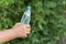 Man`s hand taking opened bottle of mineral water