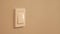 Man`s hand turns light switch on then off, Electricity.