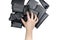 A man`s hand with a wedding ring holds a bunch of black leather goods and men`s wallets