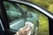 Man`s hand wipes the car`s glass with a cloth.