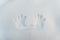 Man`s handprint on white cold snow two