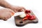 Man`s hands cutting pepper and onion with a ceramic knif