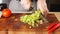 Man`s hands cutting vegetables in restauran.