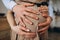 Man`s hands embrace a belly of the pregnant woman
