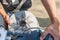 Man`s hands while grinding stones to grind corn