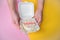 A man\'s hands hold a festive bento cake with birthday and hearts