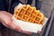 Man's Hands Holding Plain Liege Belgian Waffle