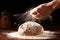 Man\\\'s hands knead the dough for baking bread. The chef