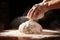 Man\\\'s hands knead the dough for baking bread. The chef