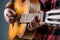 Man`s hands playing acoustic guitar, close up. Acoustic guitars playing. Music concept. Guitars acoustic. Live music